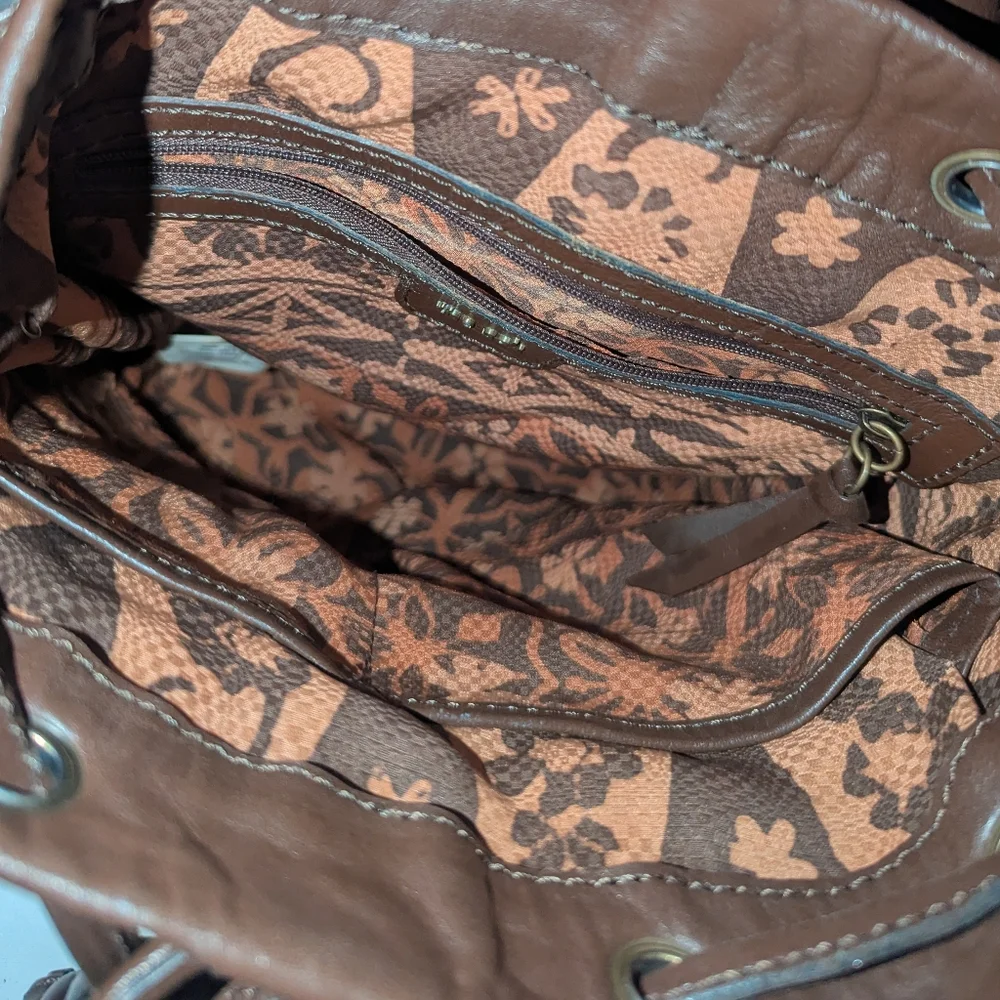 The Sak Brown Weave and Leather Backpack.